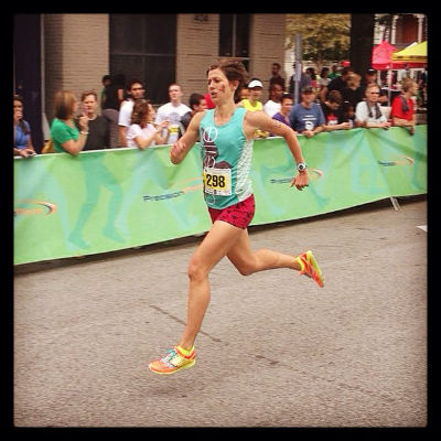 A fast female runner competing in a road race
