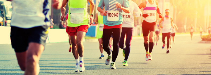 Several running competing in a road race