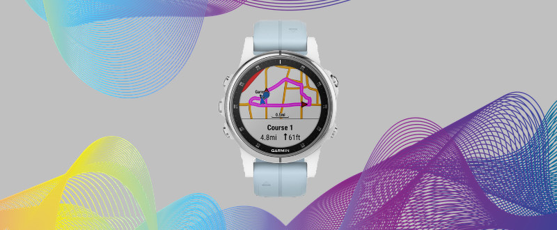 The Garmin Fenix 5 Plus on a graphical background