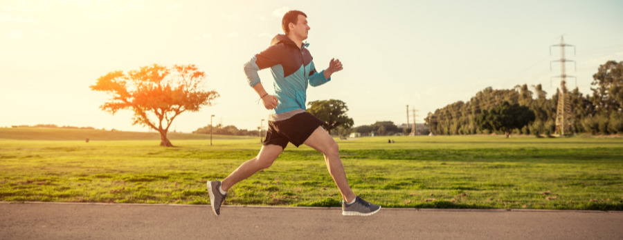 A photograph of a male runner outdoors