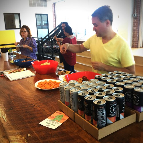 People enjoying free food at an event about the cookbook Run Fast. Cook Fast. Eat Slow.