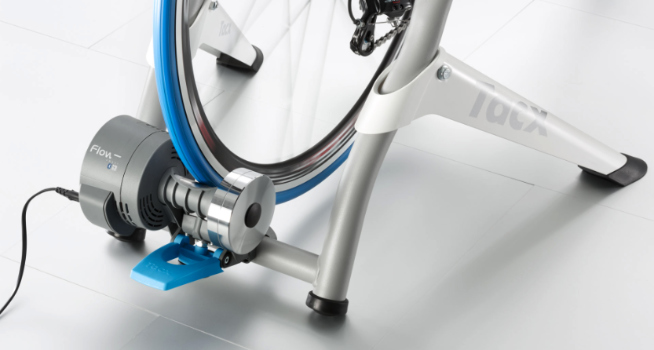 The Tacx Flow Smart bike trainer with a road bike attached