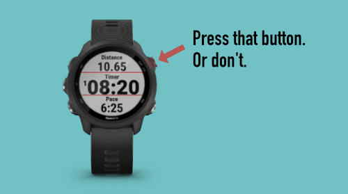 A Garmin Forerunner 245 running watch with an arrow pointing at its Start/Stop button